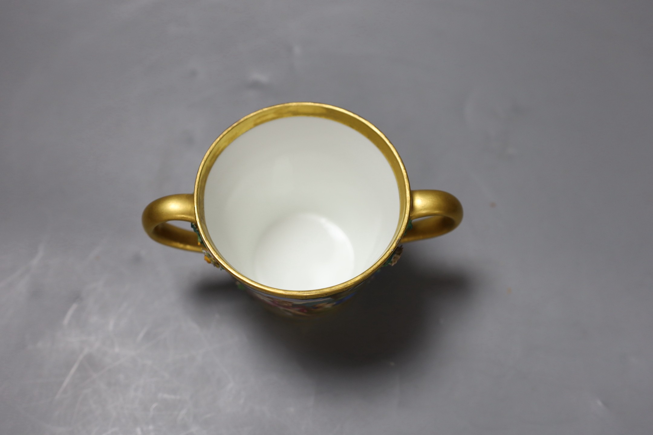 A Vienna style two handled porcelain chocolate cup and cover, c.1900, 13cms high